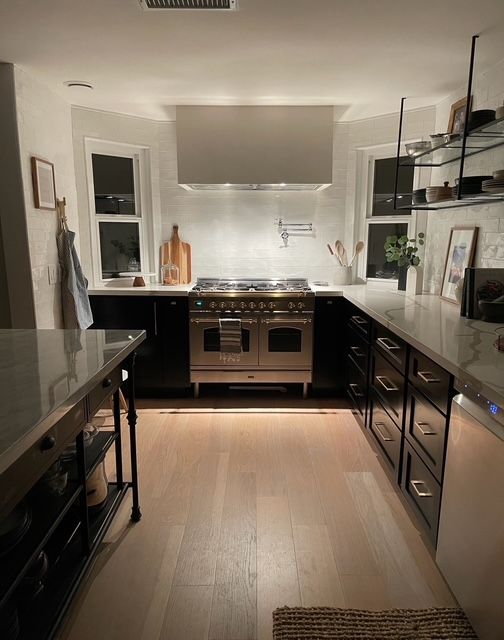 The kitchen in the evening with warm under-cabinet lighting